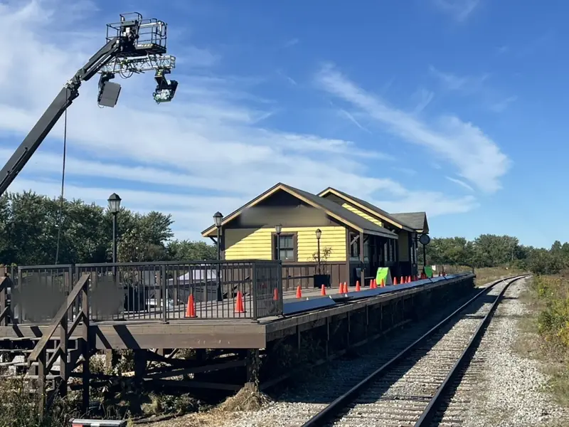 Lighting crane over a station set