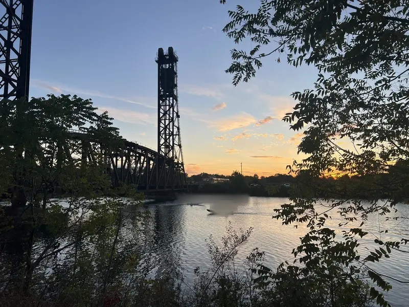 Steel rail structure silhouetted at sunset near the filming set